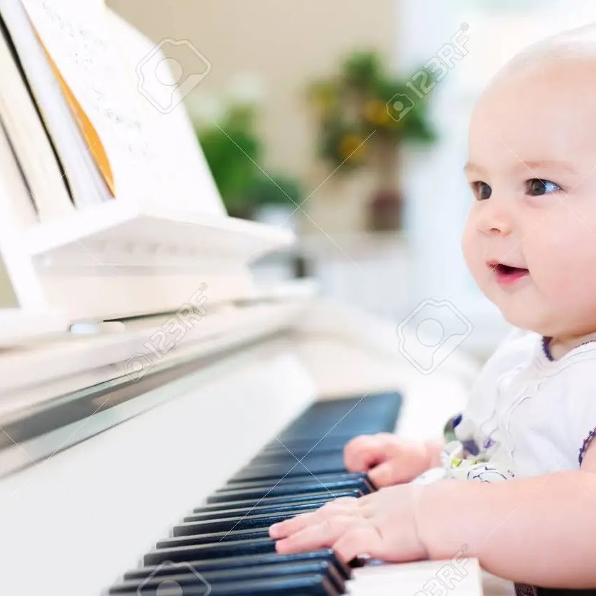 A young beginner at the piano
