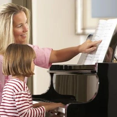A student working through early grade pieces