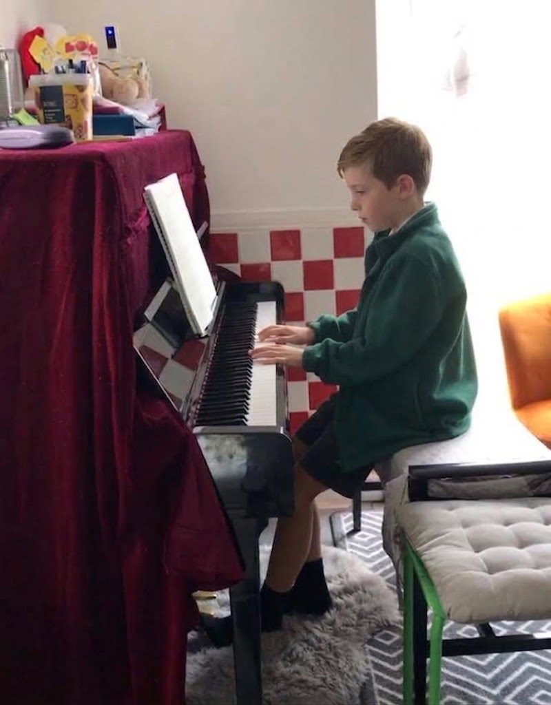 A pupil playing the piano